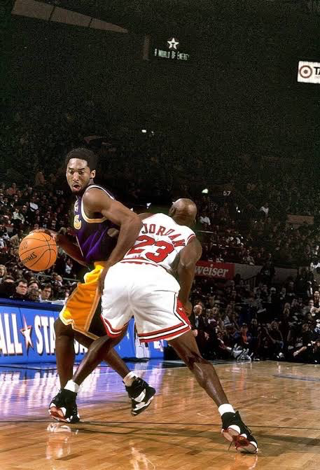 Kobe Bryant backs down Michael Jordan during the 1998 NBA All-Star Game at Madison Square Garden.